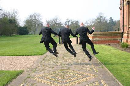 groomsmen jumping in joy